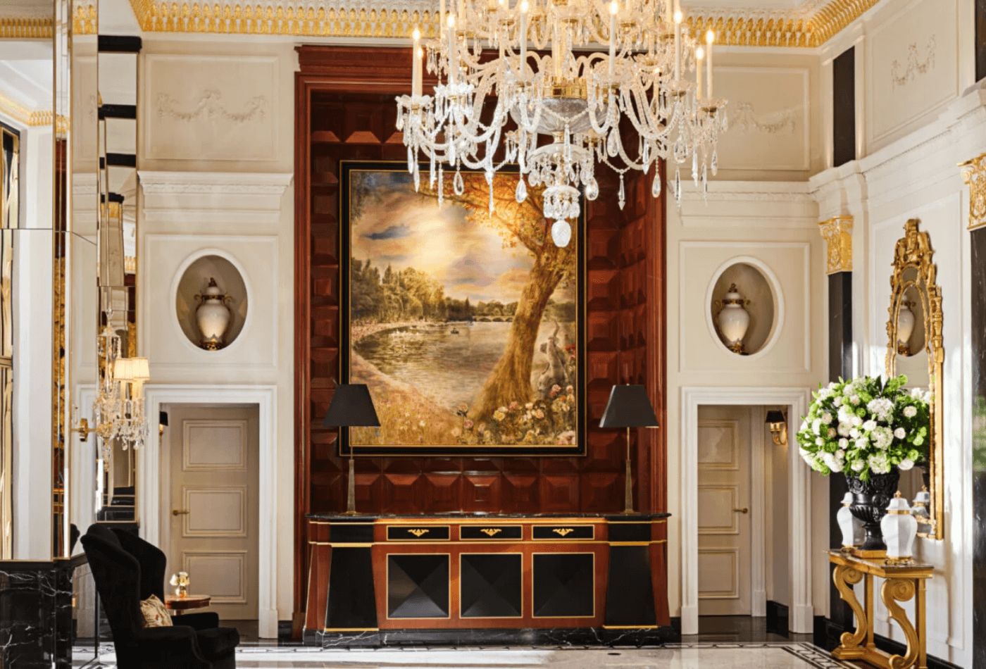 Light airy lobby with white walls and mahogany features