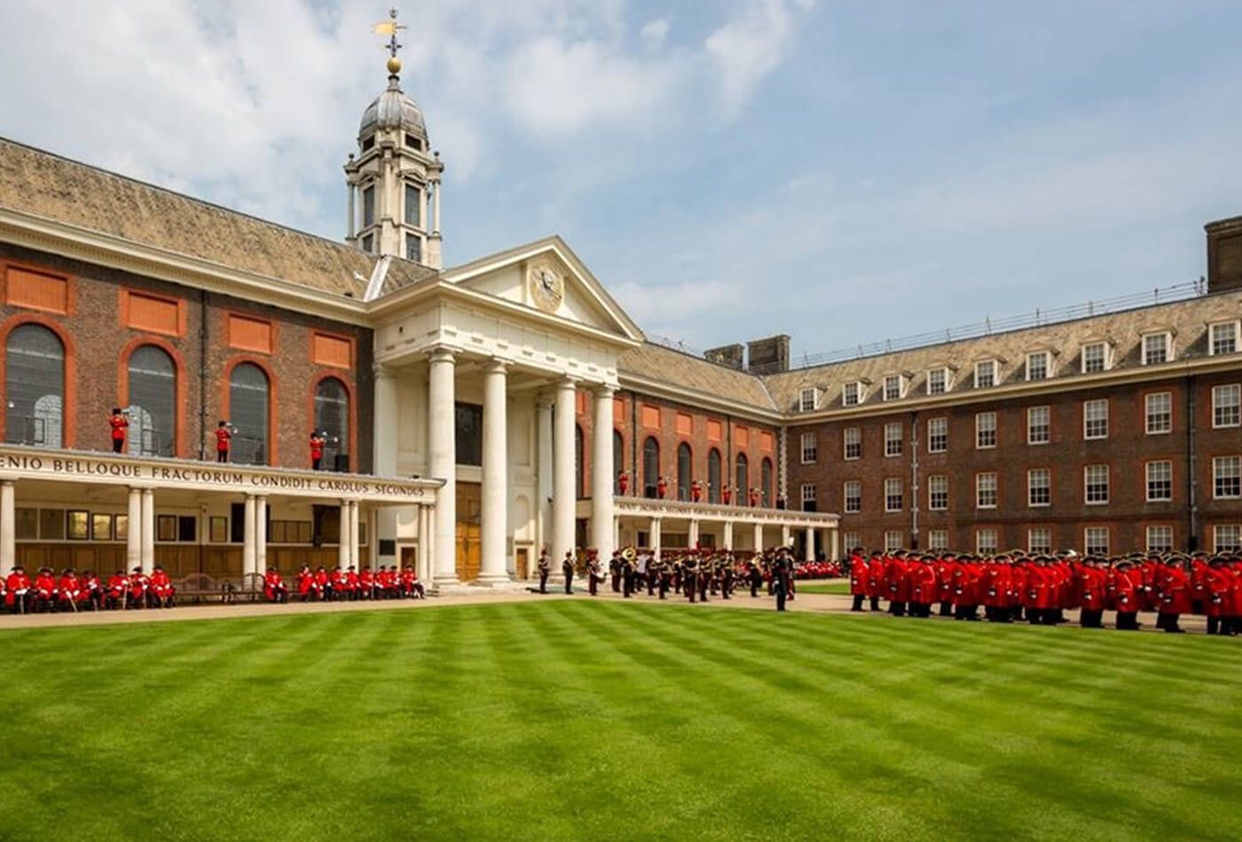 Photograph of hotel courtyard with procession of guards