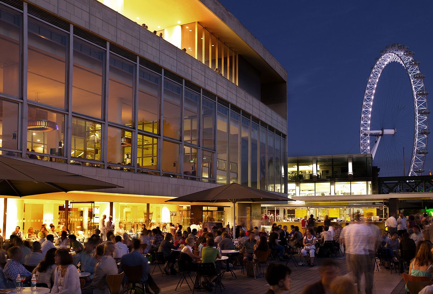 Evening photograph of Skylon building with the London Eye in the background