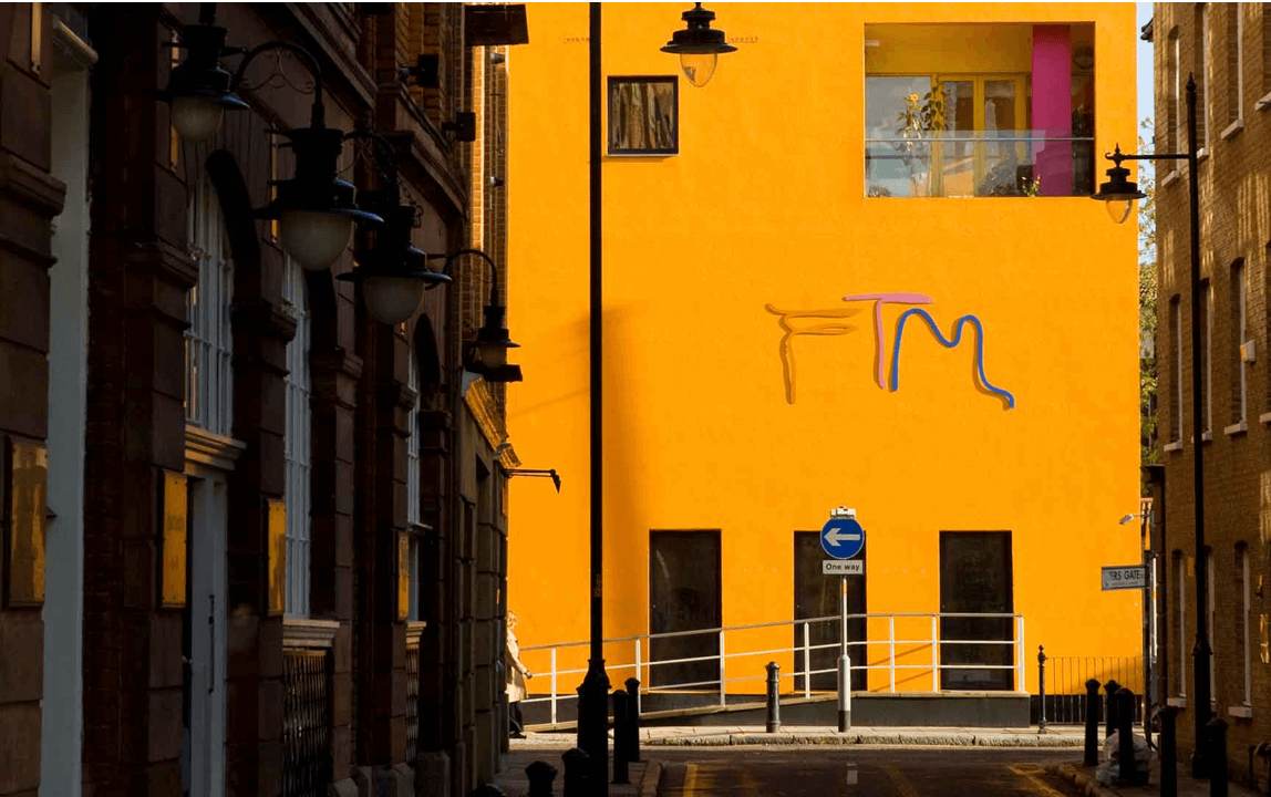 Outdoor shot of bright yellow building