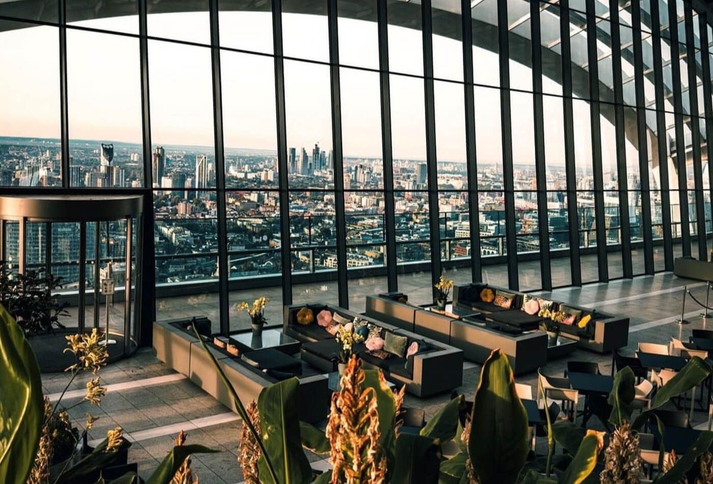 Sofas overlooking the city’s iconic skyline in the evening.