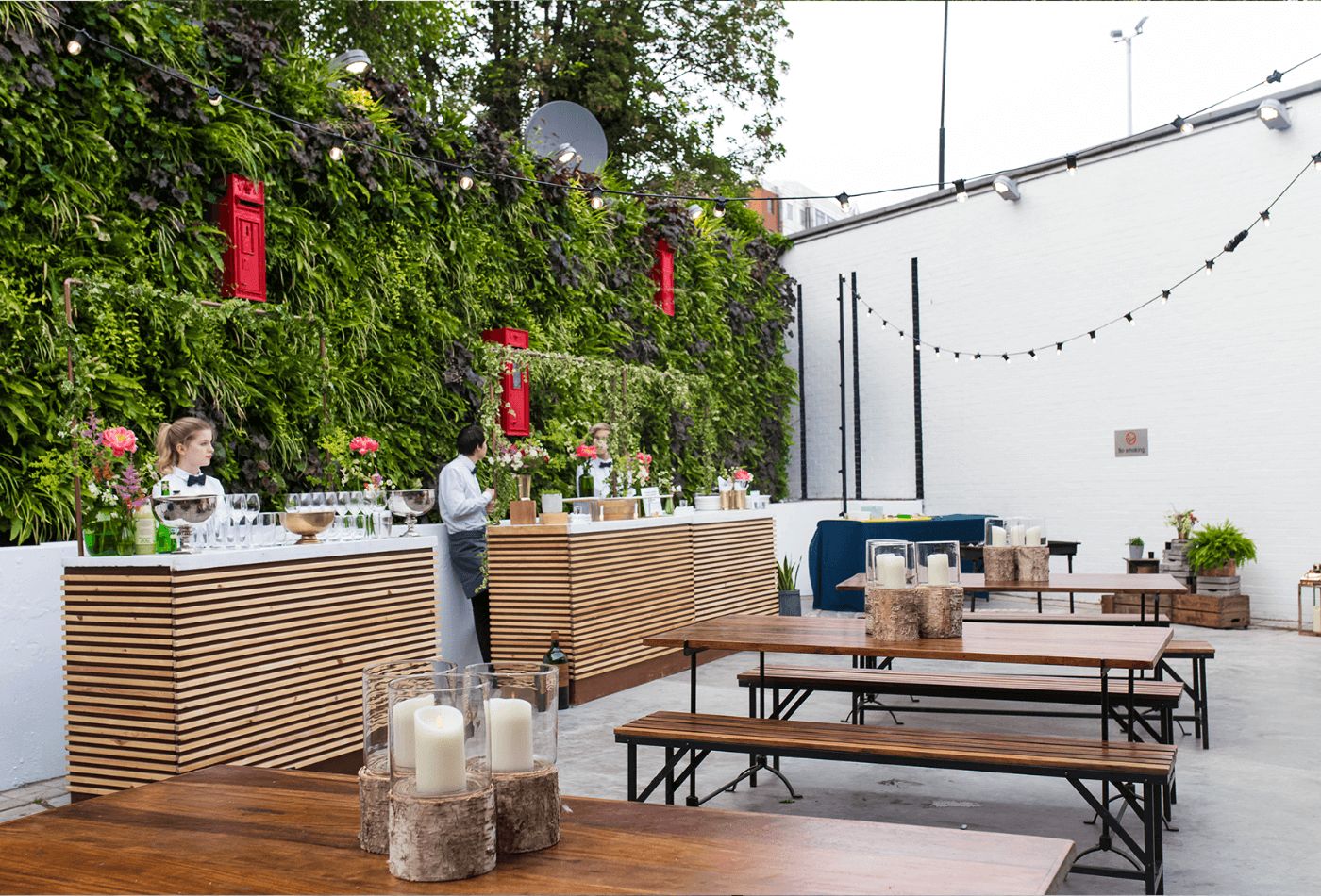 Outdoor space with wood panels and foliage.jpg