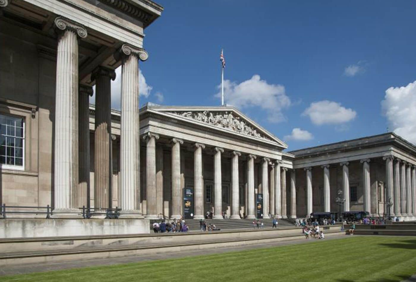 Exterior shot, large greek columns and blue sky