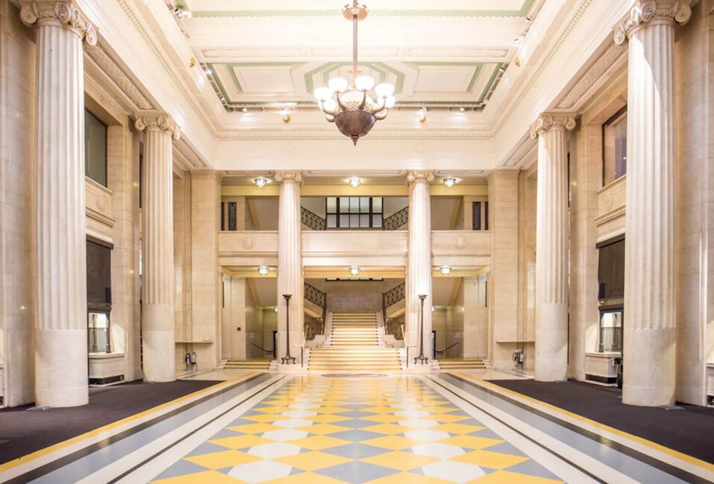 Large room with high ceilings and greek columns