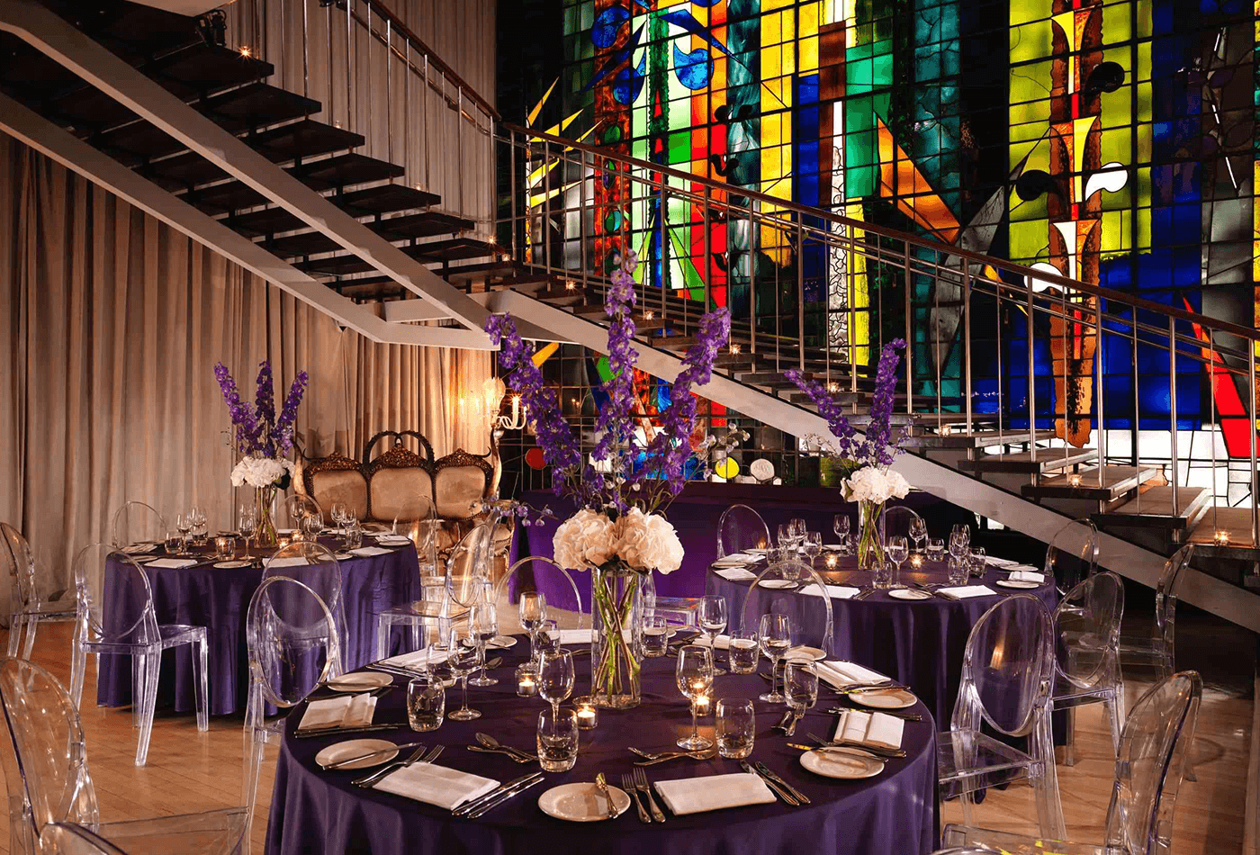 Purple dining area with silver staircase